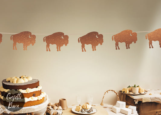 9 bison shapes measuring at 4 inches wide each.  Strung and ready to hang, glitter buffalo party banner